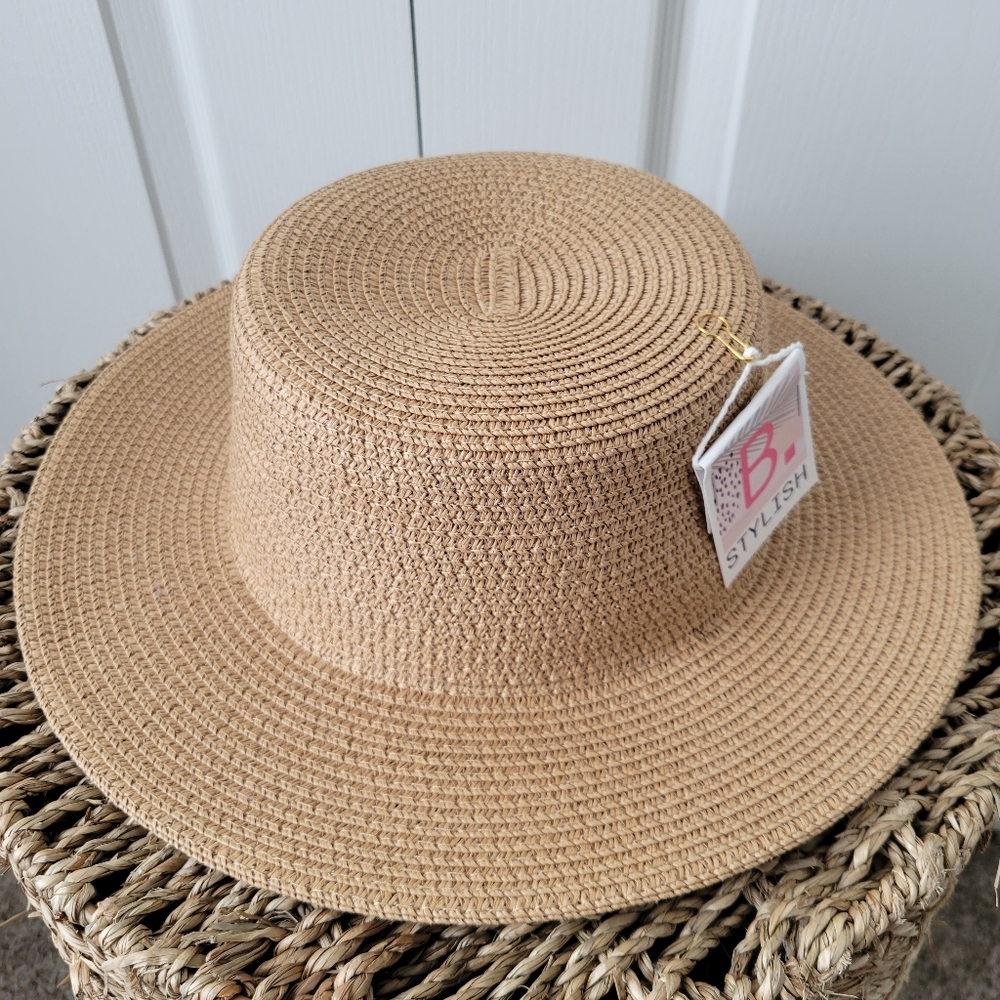 B. Stylish straw boater hat in neutral